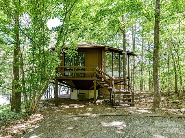 rear view of property with central air condition unit