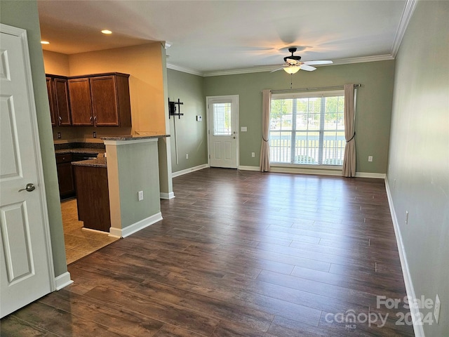 kitchen with crown molding, ceiling fan, kitchen peninsula, and dark hardwood / wood-style flooring