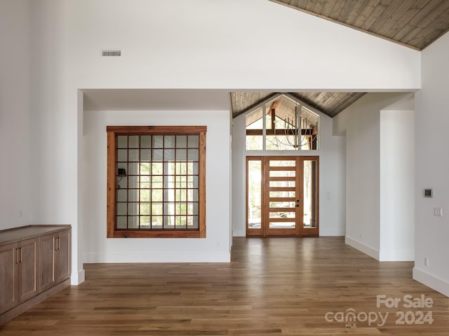 foyer with wood ceiling, dark hardwood / wood-style flooring, and lofted ceiling