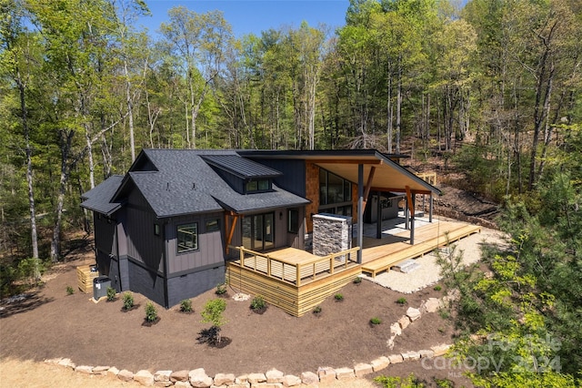 view of front of house featuring a deck and central AC