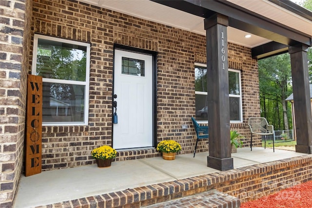 doorway to property featuring a porch