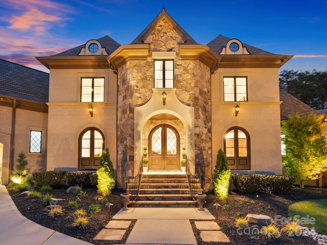 french provincial home featuring french doors