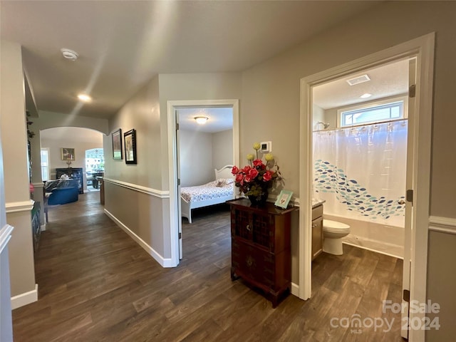 hallway featuring dark hardwood / wood-style flooring