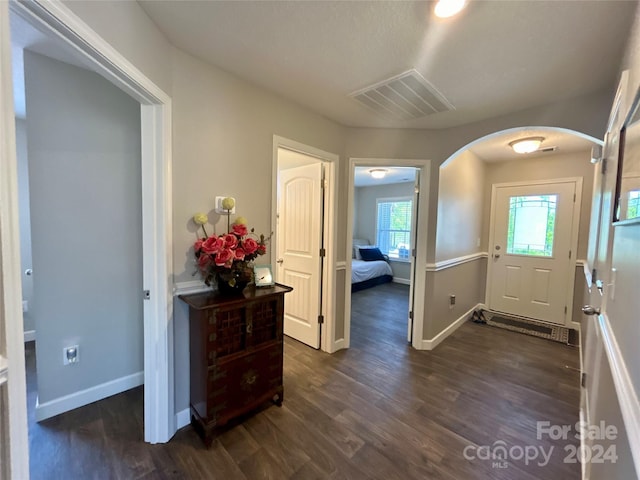 entryway with dark hardwood / wood-style floors