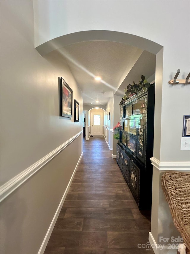 corridor featuring dark wood-type flooring