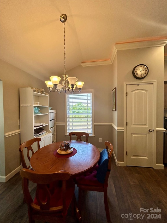 dining room featuring dark hardwood / wood-style floors, lofted ceiling, and an inviting chandelier