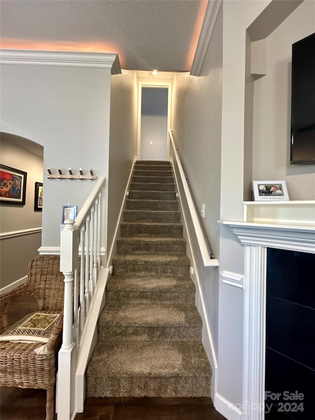 stairs with crown molding