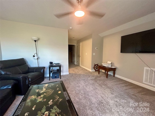 living room featuring ceiling fan and carpet flooring