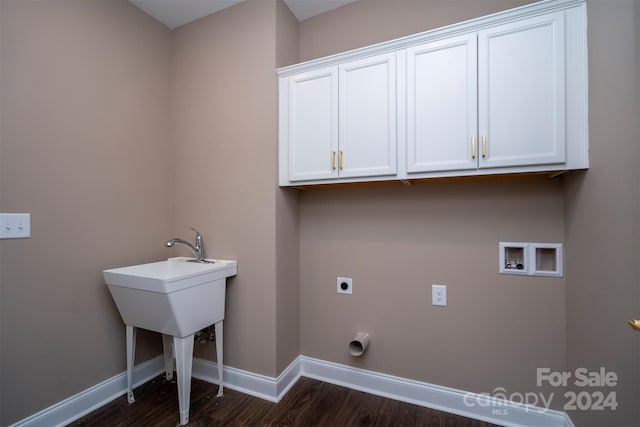 laundry room featuring dark wood-type flooring, hookup for an electric dryer, cabinets, and hookup for a washing machine