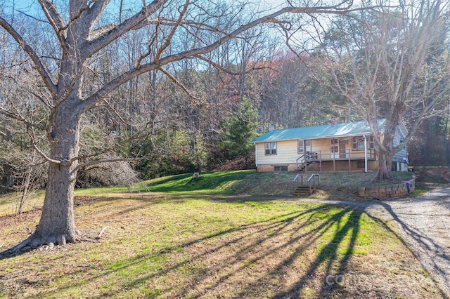 view of yard with covered porch