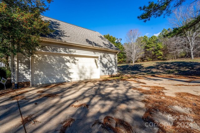 view of property exterior with a garage