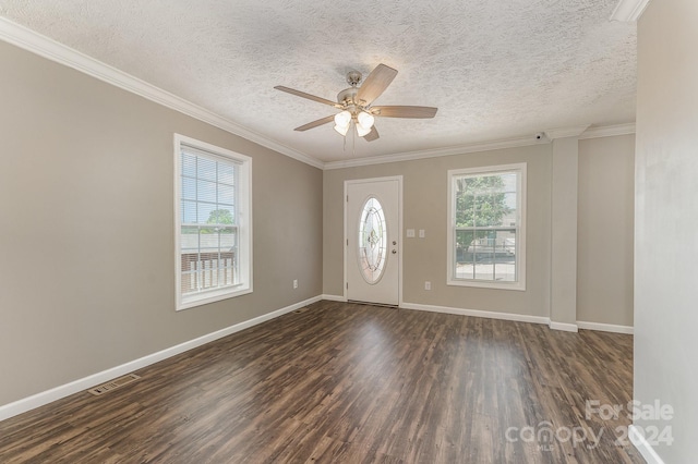 entrance foyer with ceiling fan, dark wood-type flooring, a textured ceiling, and ornamental molding