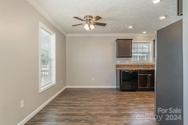 kitchen featuring ornamental molding, a textured ceiling, ceiling fan, and dark wood-type flooring