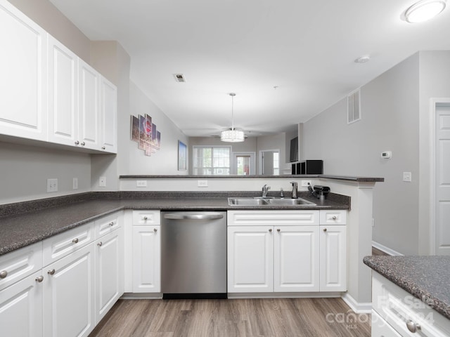 kitchen with light hardwood / wood-style flooring, sink, dishwasher, and white cabinetry