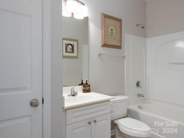 full bathroom featuring shower / bath combination, vanity, and toilet