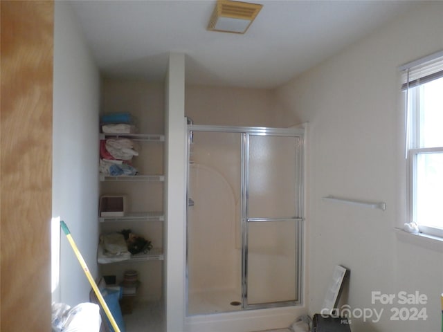 bathroom featuring an enclosed shower