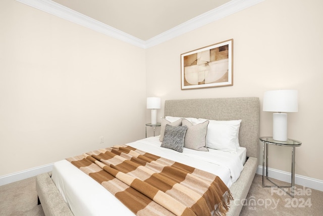 carpeted bedroom featuring crown molding