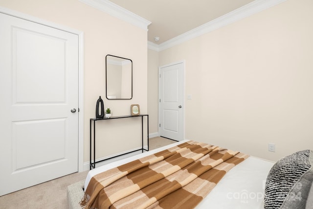 bedroom featuring ornamental molding and light carpet