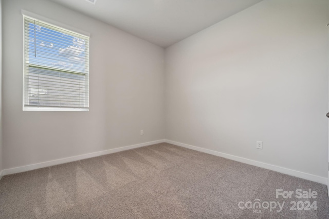 empty room featuring carpet flooring