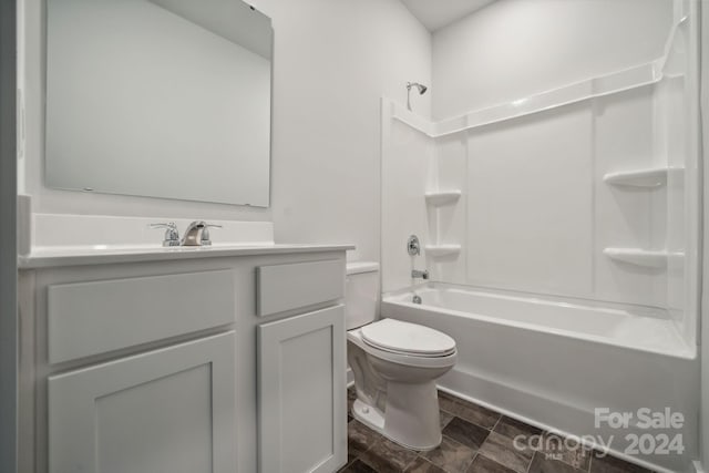 full bathroom featuring toilet, vanity, and bathing tub / shower combination