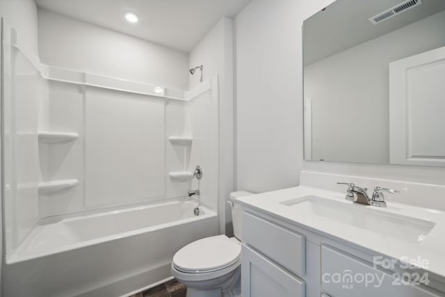 full bathroom featuring shower / tub combination, vanity, and toilet