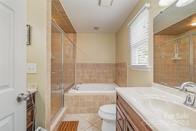 full bathroom featuring independent shower and bath, toilet, tile floors, and vanity