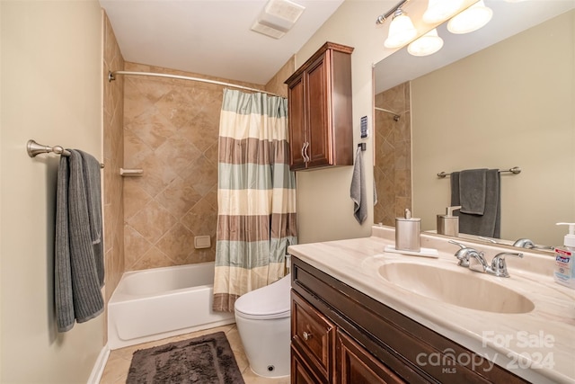 full bathroom featuring shower / bath combo, vanity, tile floors, and toilet