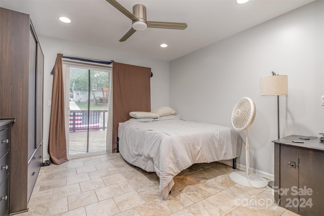 tiled bedroom with ceiling fan and access to exterior