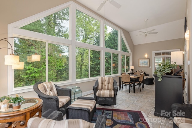 sunroom / solarium with lofted ceiling and ceiling fan