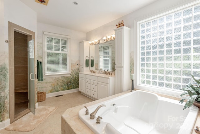 bathroom featuring tile patterned floors, vanity, and separate shower and tub