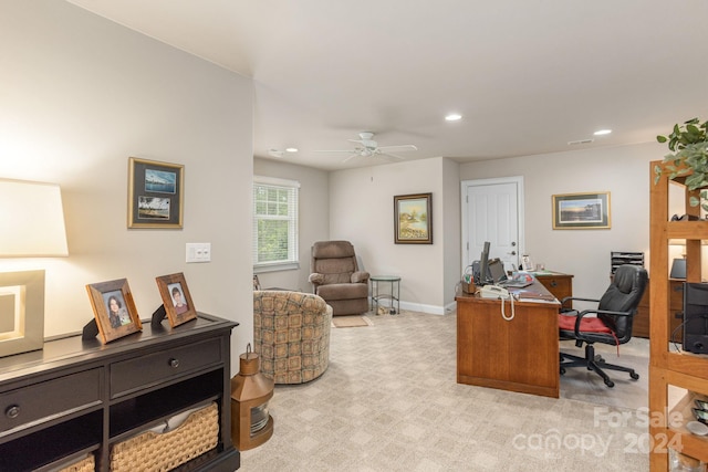 carpeted office featuring ceiling fan