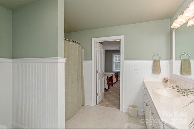 bathroom with tile patterned floors, vanity, and a shower with curtain