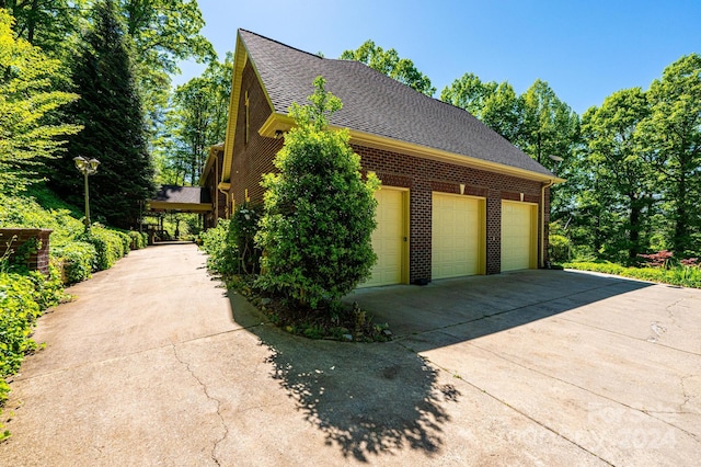 view of side of property with a garage