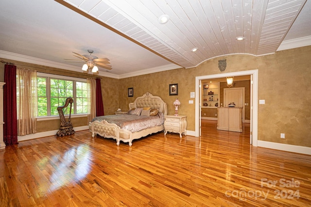 bedroom with ceiling fan and hardwood / wood-style flooring