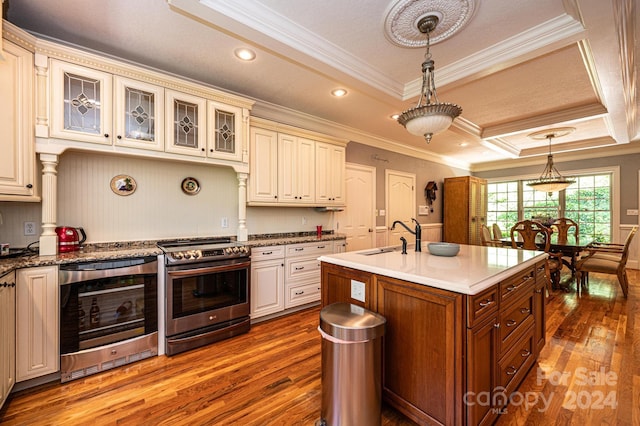 kitchen featuring stainless steel stove, wine cooler, crown molding, sink, and hardwood / wood-style flooring