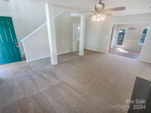 spare room with ceiling fan and carpet floors