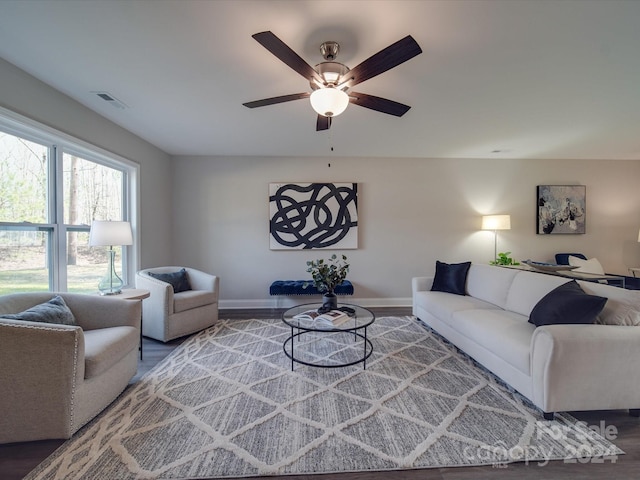 living room with ceiling fan and wood-type flooring