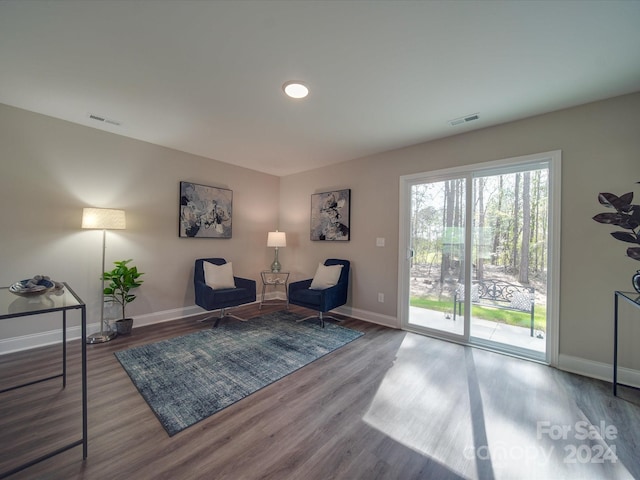 sitting room with hardwood / wood-style floors