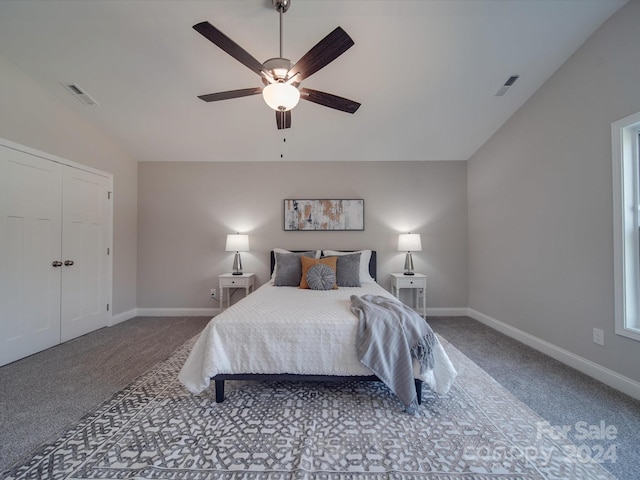 carpeted bedroom featuring lofted ceiling, a closet, and ceiling fan