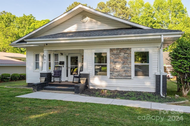 bungalow featuring a porch and a front yard