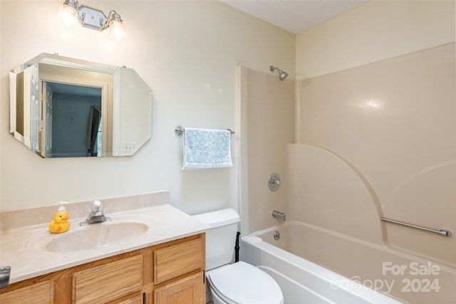 full bathroom with vanity,  shower combination, and toilet