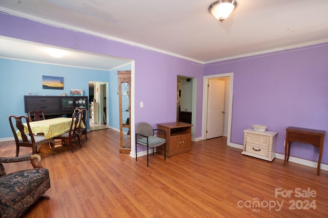 office space featuring crown molding and light wood-type flooring