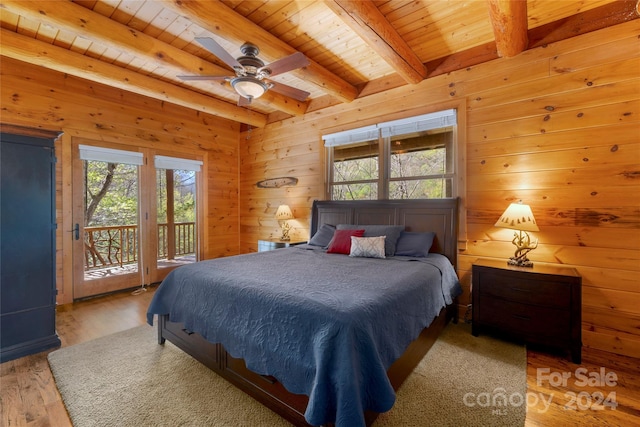 bedroom featuring ceiling fan, wood ceiling, beam ceiling, access to outside, and hardwood / wood-style flooring