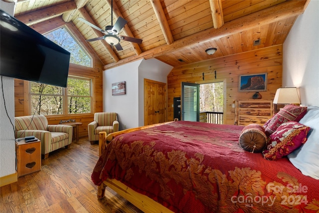 bedroom featuring wood ceiling, wood-type flooring, lofted ceiling with beams, and multiple windows