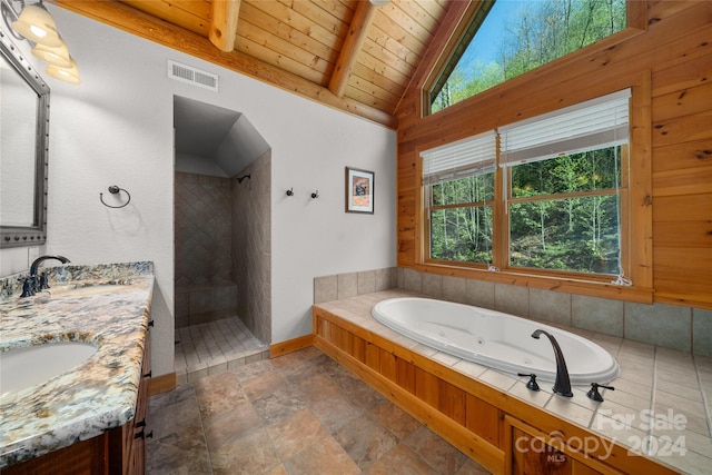 bathroom featuring lofted ceiling with beams, wooden ceiling, a tub, tile floors, and dual vanity