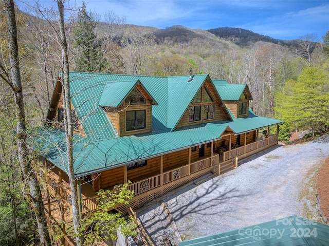 exterior space featuring a mountain view and covered porch