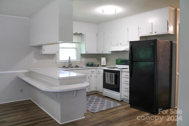 kitchen featuring white electric range oven, black refrigerator, white cabinetry, and sink