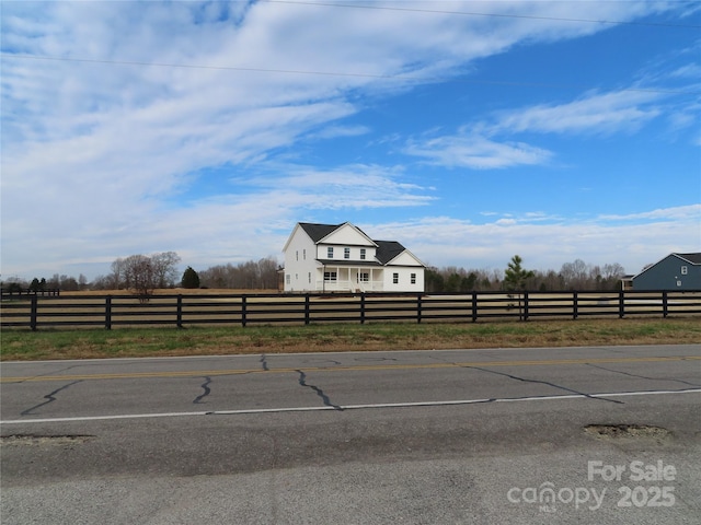 view of yard with a rural view