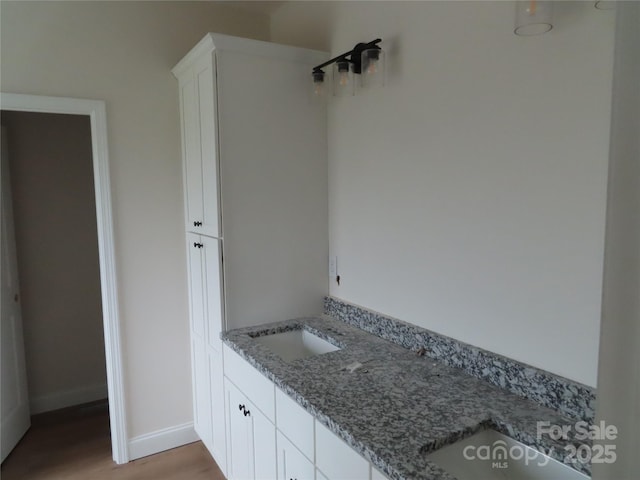 bathroom featuring vanity and hardwood / wood-style floors