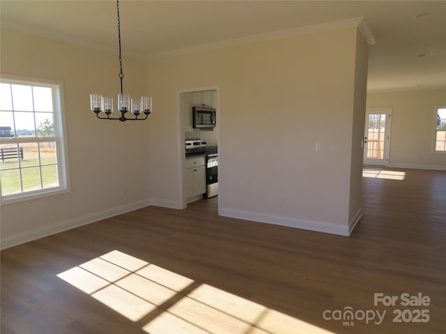 unfurnished dining area featuring dark hardwood / wood-style flooring, a notable chandelier, and ornamental molding